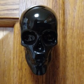 gothic knobs on a wooden cabinet