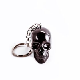 Gothic keychain with a macabre black skull design.