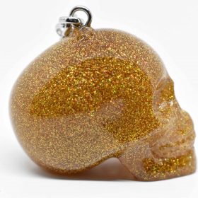 Handmade gold glitter skull keychain with a glamorous shine