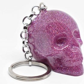 Handmade pink glitter skull keychain with shimmering effect