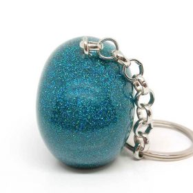 Teal glitter skull keychain with hand-sanded finish
