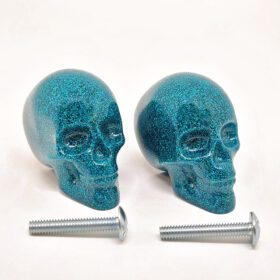 gothic drawer handles featuring teal glitter skull knobs